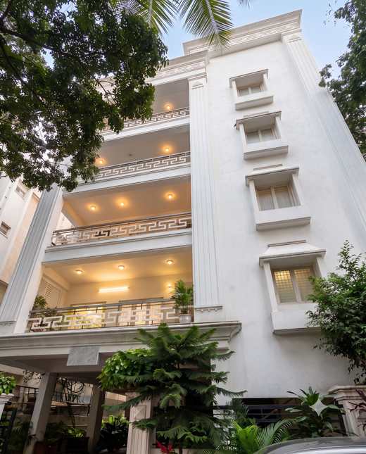 The white façade of Titiksha, home of Renu’z Homestay, in P.S. Nagar, Masab Tank