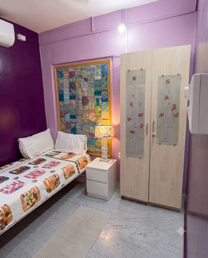 The etched-glass wardrobe with silver blossom panels in the Swing Room
