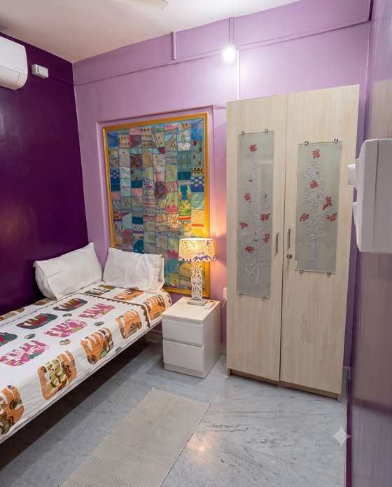 The etched-glass wardrobe with silver blossom panels in the Swing Room
