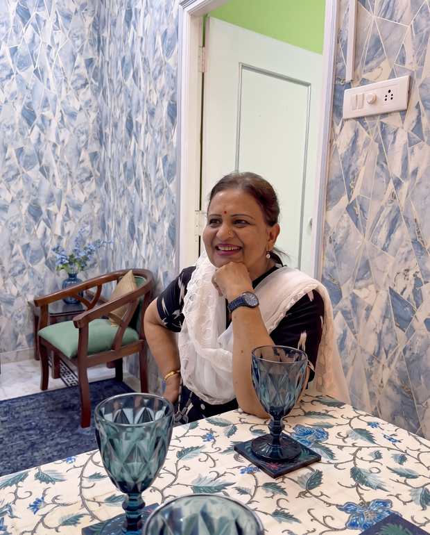 Renu, who hosts Renu’z Homestay, at the dining table in Titiksha