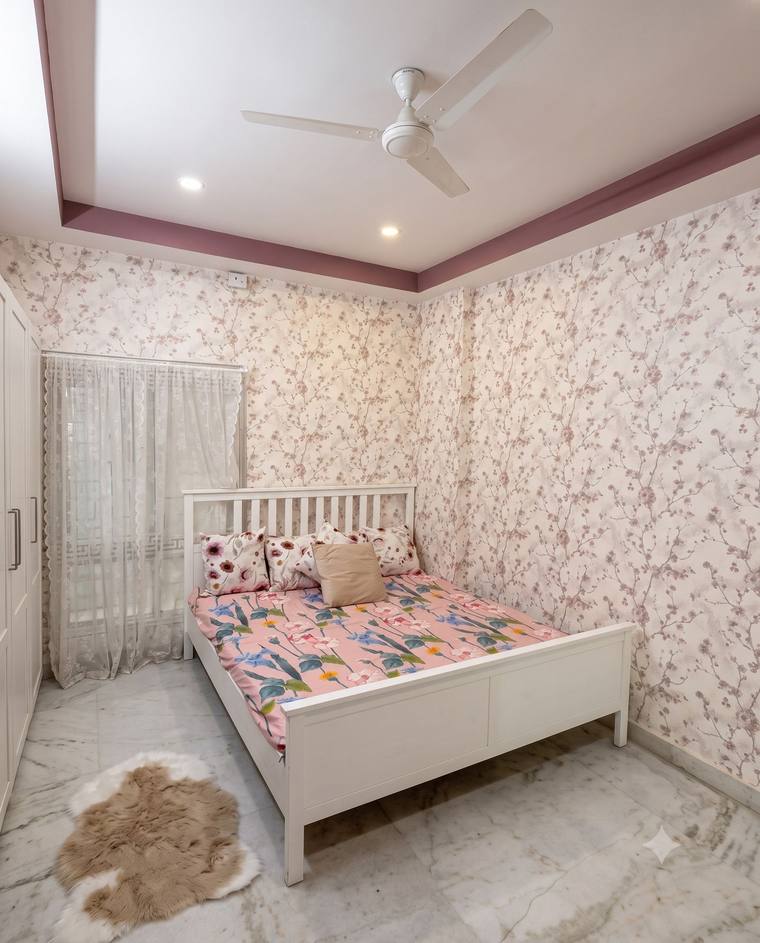 The Rose Room at Renu'z Homestay, with cherry-blossom wallpaper and a mauve ceiling trim